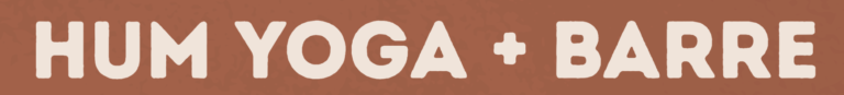 A logo featuring the text "hum yoga + barre" in large, white, stylized font on a warm brown background.